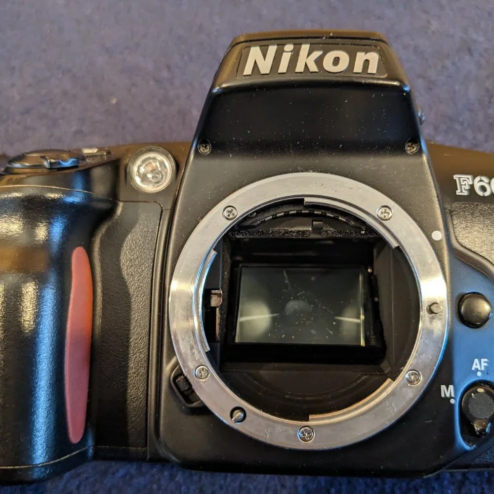 Nikon SLR F60 body for parts/repair. Lens is in great condition.